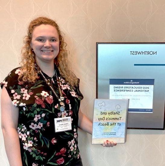 Caitlynn Moniz holding her and Parris's book.